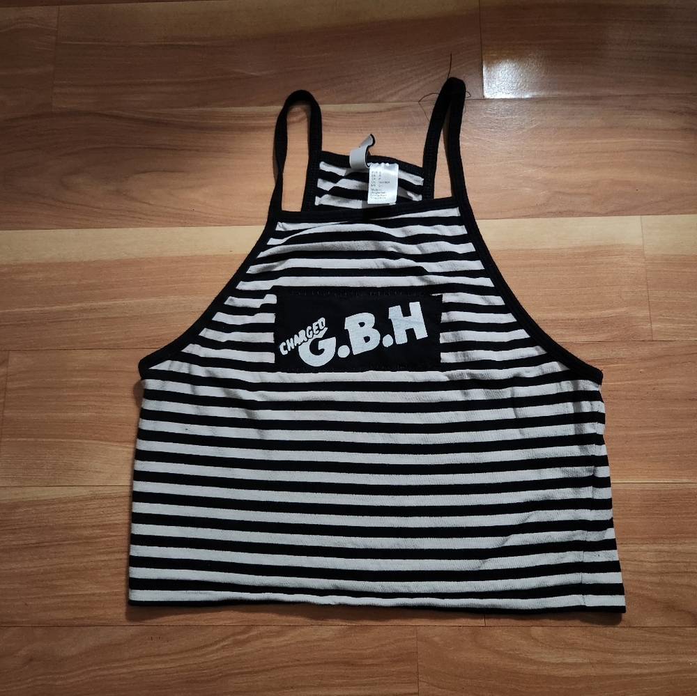 Black and white striped tank top with patch of the band charged G.B.H.